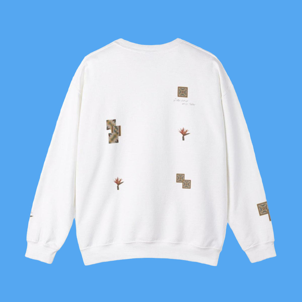 White sweatshirt with various patches on a white background