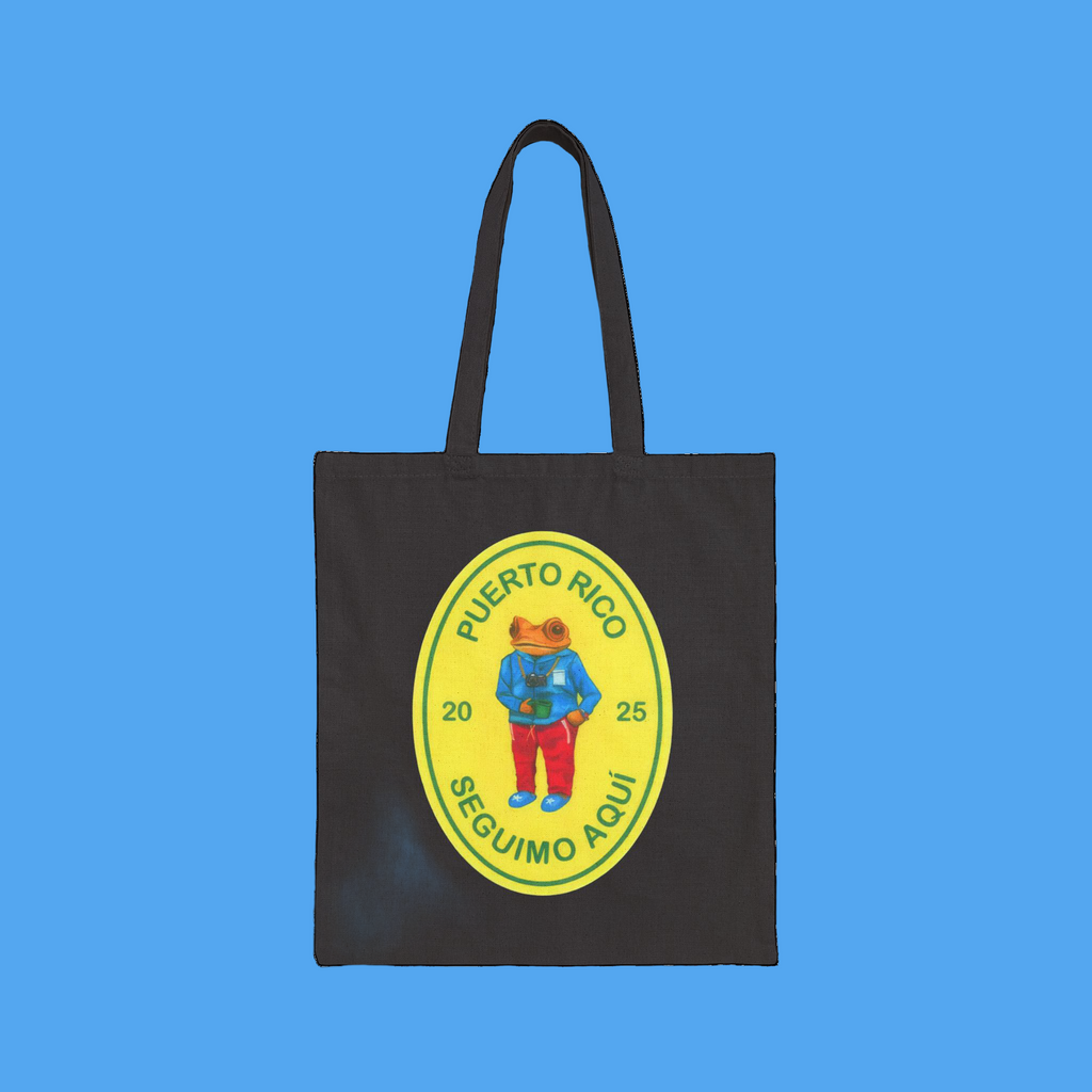 Black tote bag with a colorful graphic of a bear and text on a white background