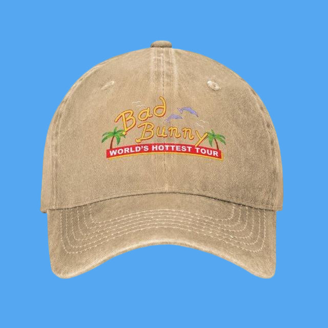 Beige cap with 'Bad Bunny World's Hottest Tour' text and graphics on a white background