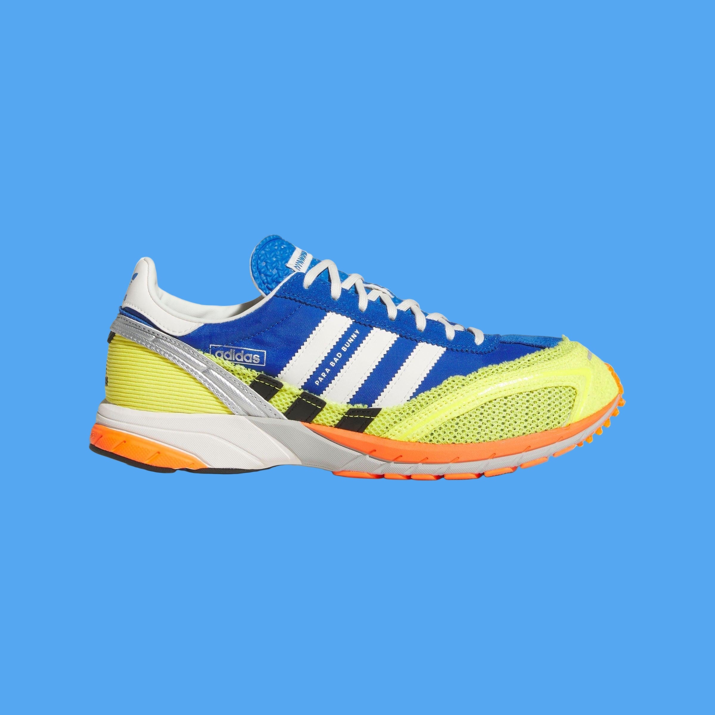 Colorful Adidas sneaker with blue, yellow, and orange accents on a light gray background