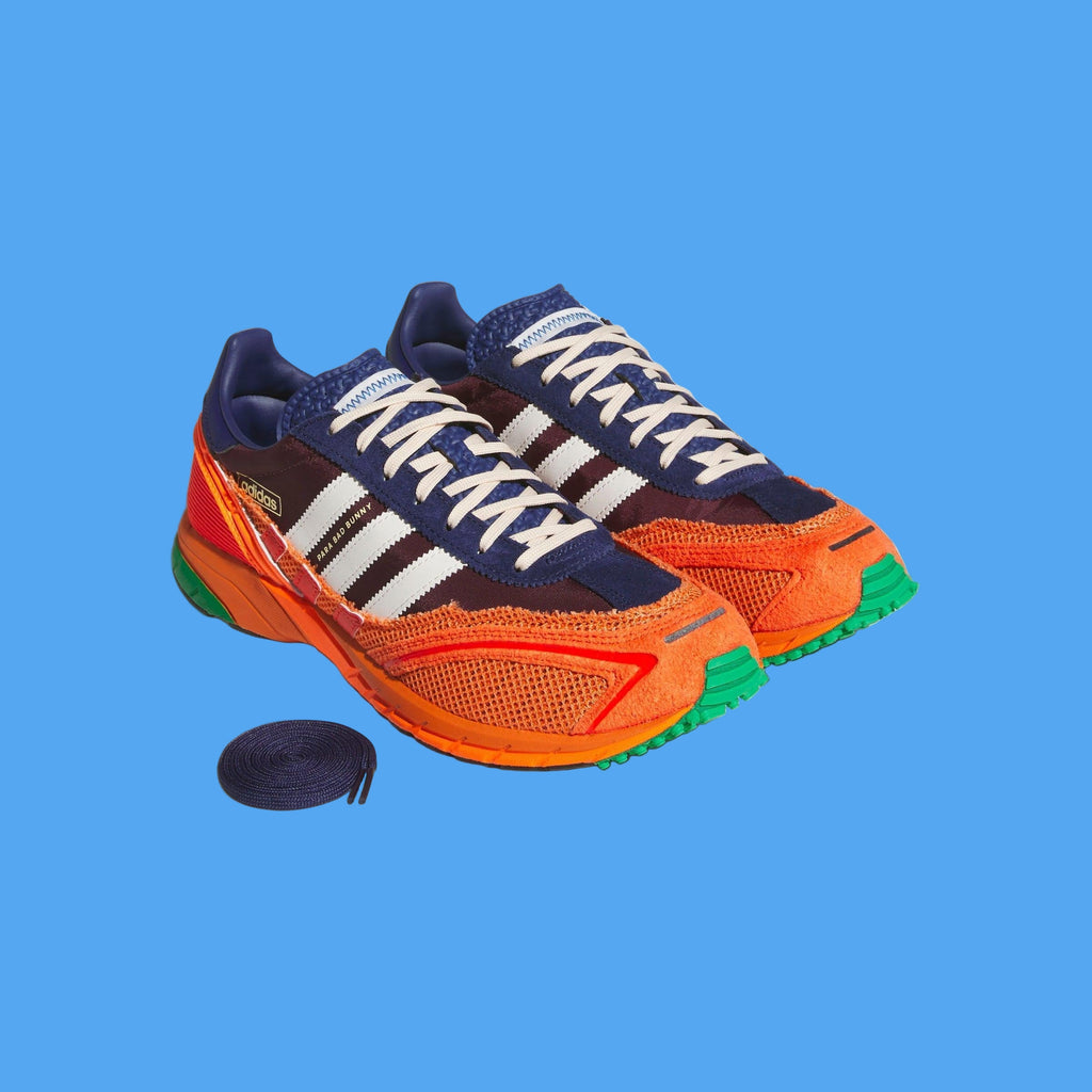 Colorful running shoes with orange, blue, and green accents on a light gray background
