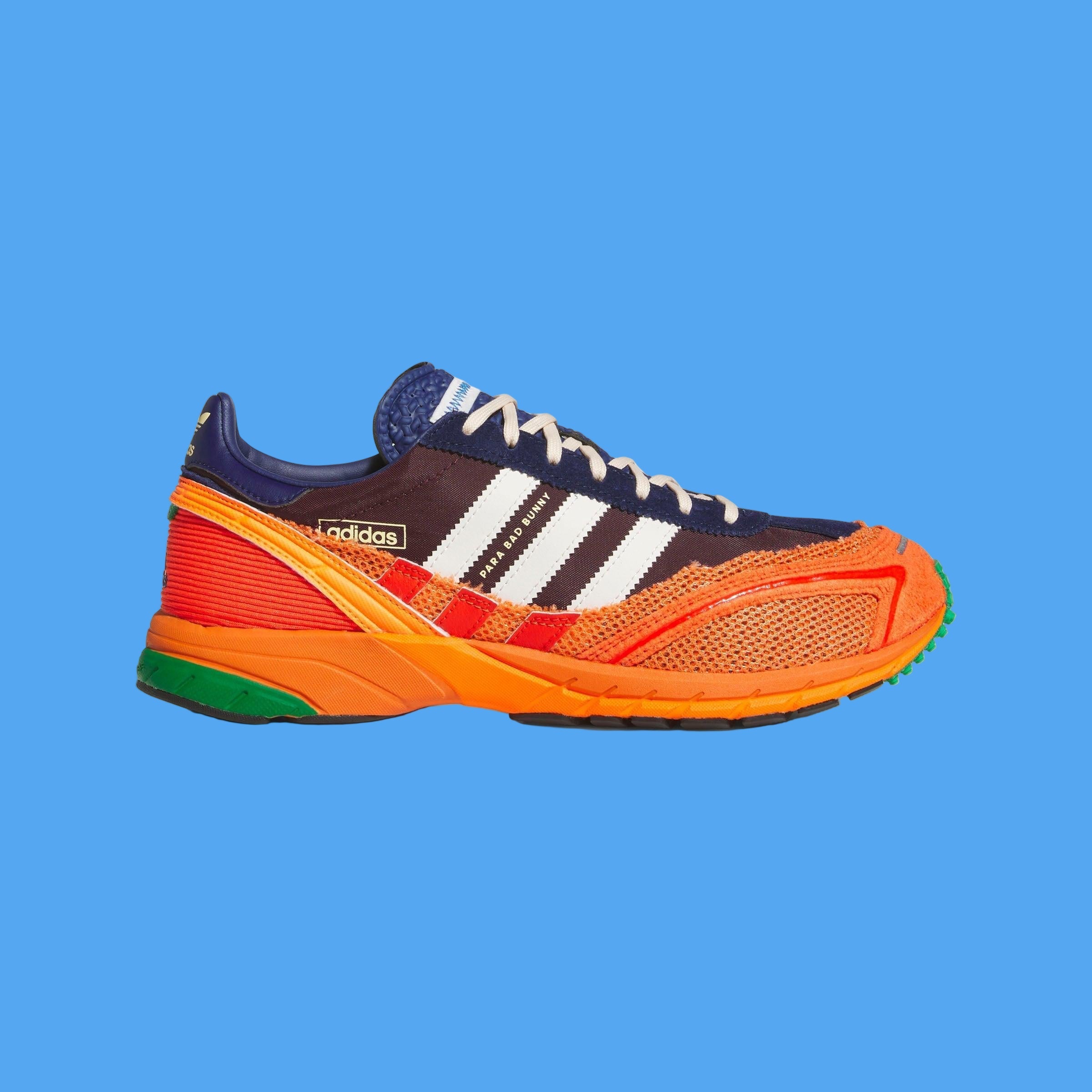 Adidas sneaker with orange and blue design on a light gray background